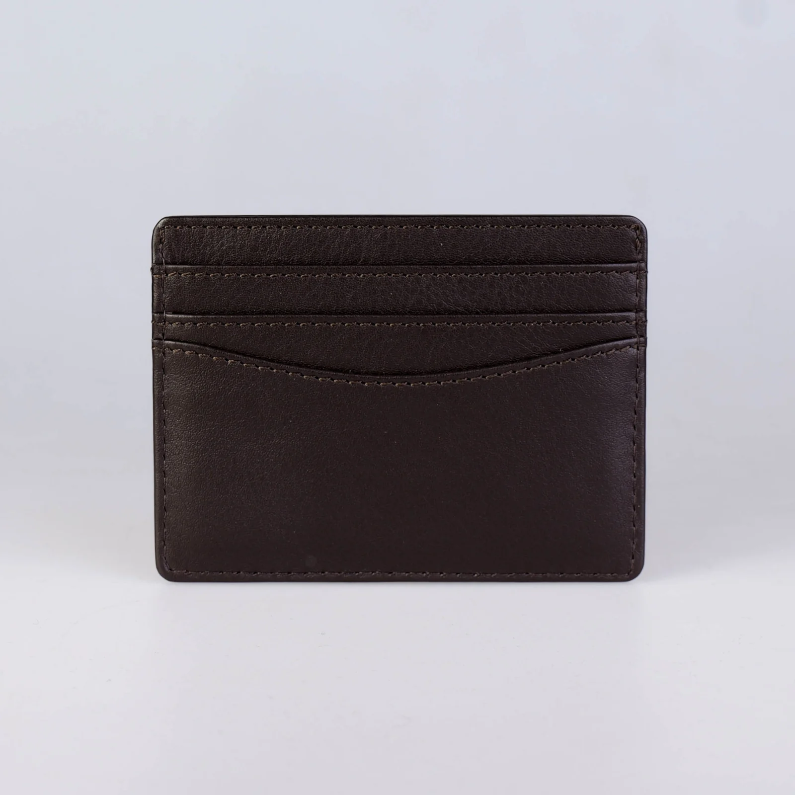 Back of The Diplomat Espresso cardholder showing debossed BISWAS LONDON